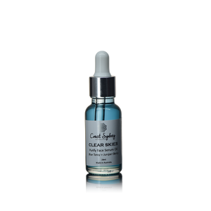 A blue face serum oil in a dropper bottle named 'Clear Skies.' 