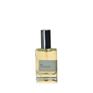 'Joy' oil perfume presented in a roller bottle